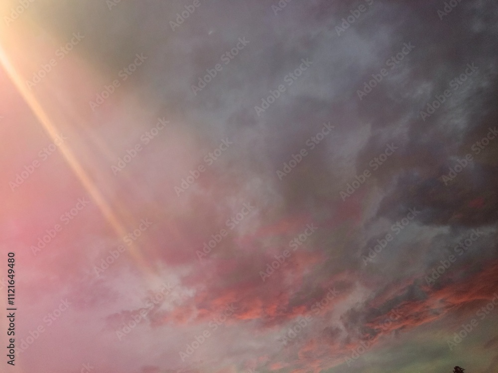The sky is at sunset. Beautiful clouds on the background of sunset.Dramatic cloud in sunset scene for wallpaper