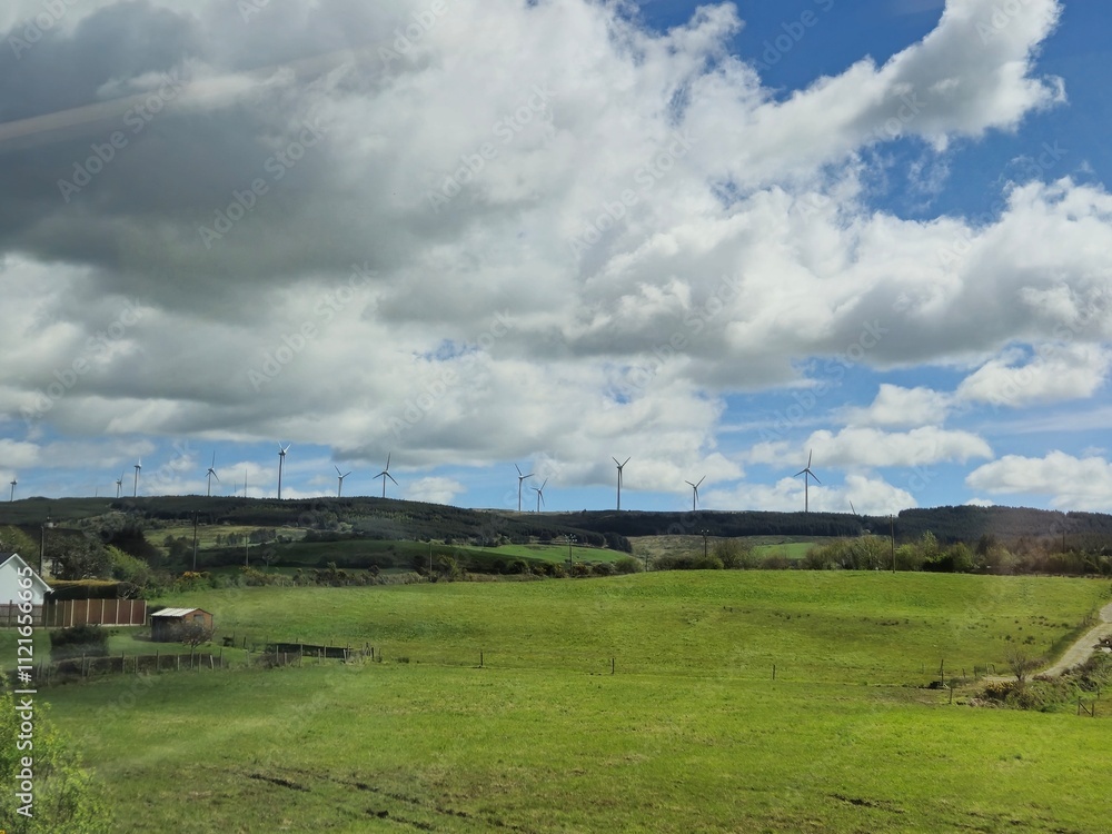 Highland Landscape with Cumulus Clouds and Wind Farms Highland Landscape with Cumulus Clouds and Wind Farms