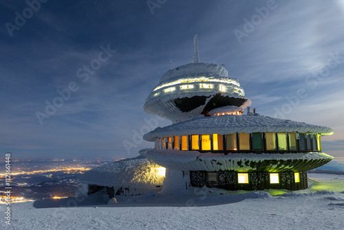 Meteorogical observatory and weather station on the summit of Śnieżka during winter full moon night