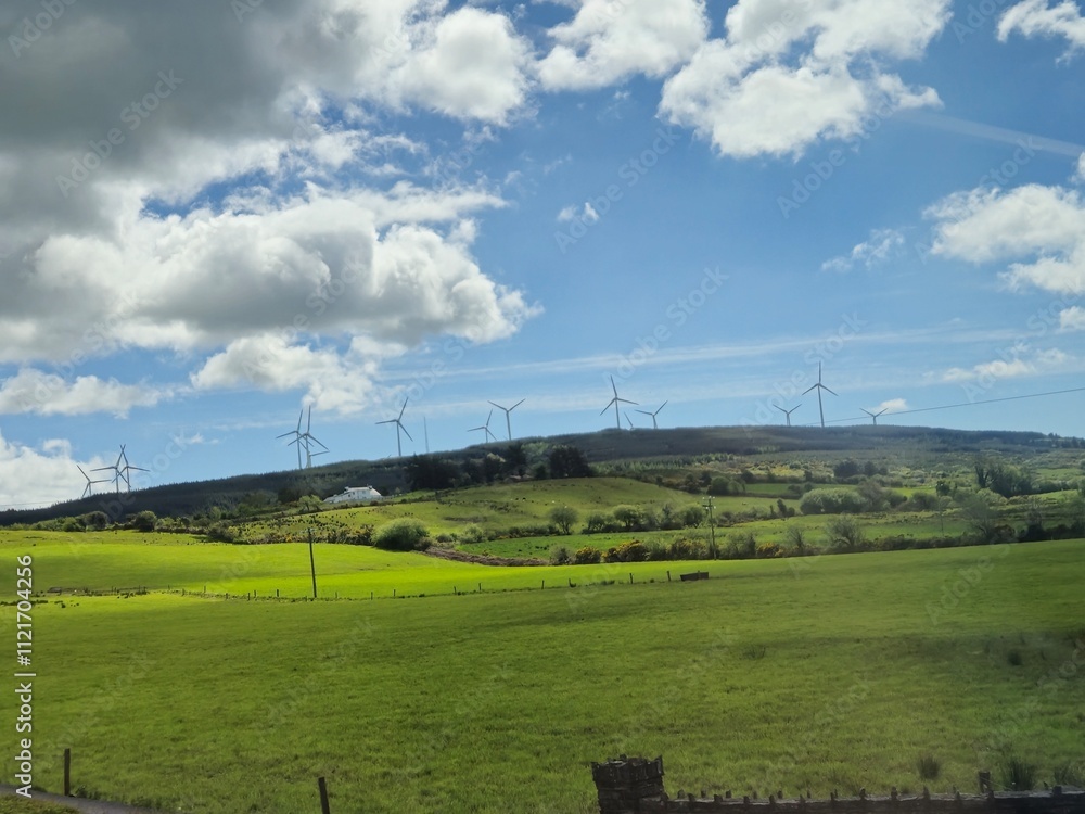 Wind Farm in Highland Landscape Under Cloudy Sky Wind Farm in Highland Landscape Under Cloudy Sky