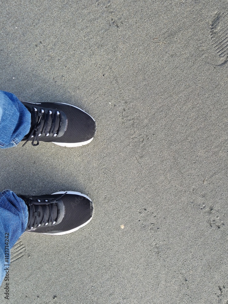 Fototapeta premium Foot prints on sea side beach background