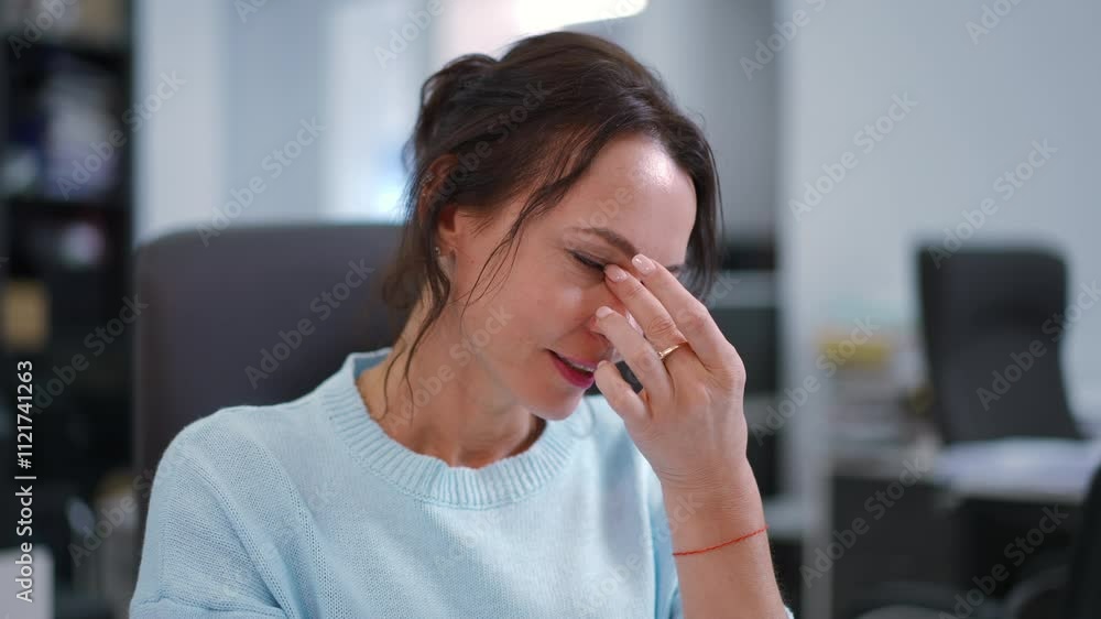 A focused woman in a modern office, embodying professionalism and deep concentration while she works A focused woman in a modern office, embodying professionalism and deep concentration while she works