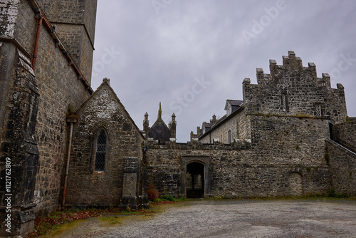 Stone architecture of Augustinian Friary in Adare, Ireland, showcasing medieval charm and history photo