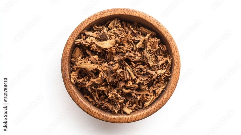 Dried tobacco leaves in a wooden bowl on a white background showcasing texture and detail of the natural product. Dried tobacco leaves in a wooden bowl on a white background showcasing texture and detail of the natural product.