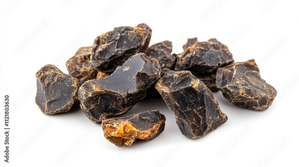 Natural Shilajit resin rocks isolated on a clean white background showcasing their unique texture and appearance for health and wellness concepts. Natural Shilajit resin rocks isolated on a clean white background showcasing their unique texture and appearance for health and wellness concepts.