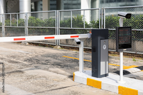 A parking meter with a camera on top of it. car park barrier, automatic entry system. photo