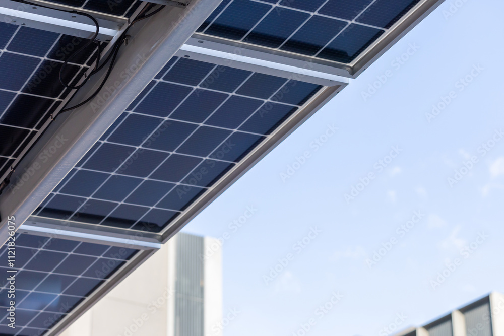 Obraz premium A solar panel is on a roof building of parking lot.