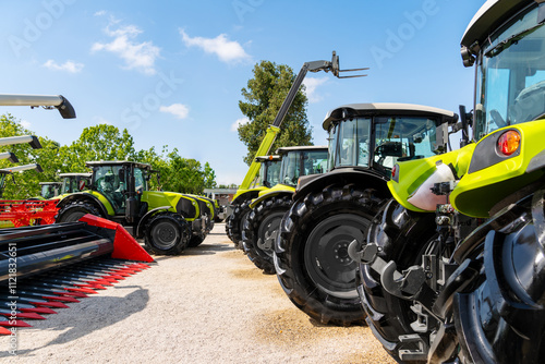 Photos Agricultural machinery displayed at outdoor agri equipment dealership during summer