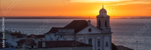 Panorama view of the Alfama District skyline and Santo Estevao Church from Das Portas Do Sol