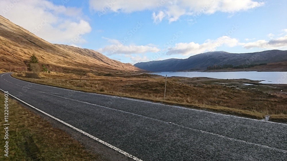 Naklejka premium The beautiful road through the Highlands