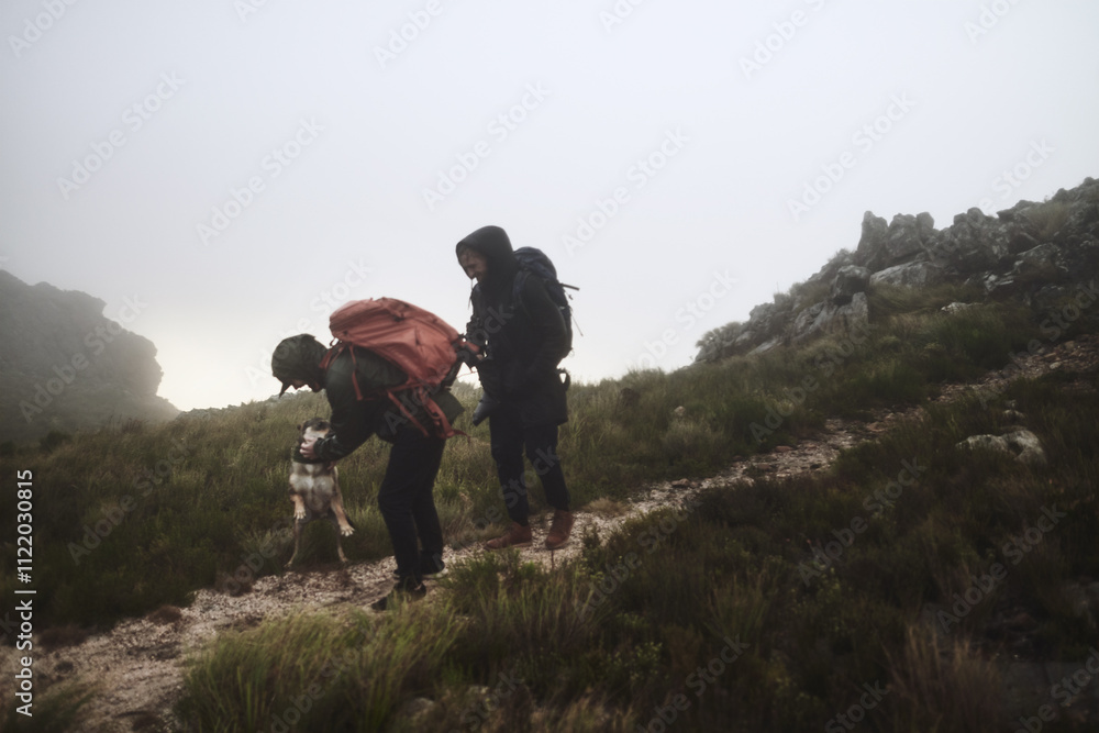 Obraz premium People, hiking and outdoor fitness with dog, extreme terrain and nature for winter adventure. Path, friends and trekking journey on remote vacation, explore wilderness and pet animal for affection