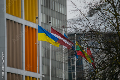 Ukraine and Baltic States flags next to each other in wind photo