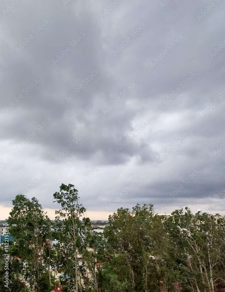Fototapeta premium time lapse of dark clouds pattern in blue sky over the city background, nature photography, natural scenic view, dramatic weather conditions