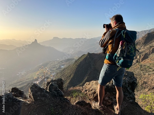 Roque Bentayga. The Nublo Park offers a landscape of dismantled structures and sharp slopes with spectacular areas of great interest. Location: Artenara, Tejeda. Man photographer takes a perfect shoot photo