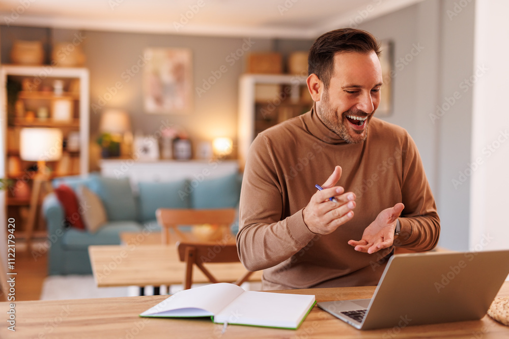 Obraz premium Portrait of cheerful web designer explaining ideas to client over video call on laptop in home office