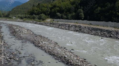 Mountain river flowing through green valleys in Racha Georgia