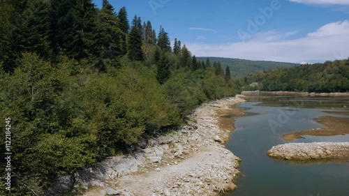 Mountain river flowing through green valleys in Racha Georgia