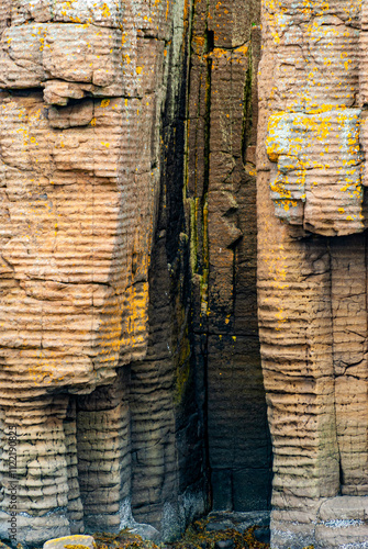 Basalt Cliffs in Breidafjordur Fjord of Iceland.  photo