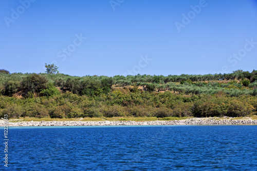 Lake Kournas on Crete and the mountains behind it photo