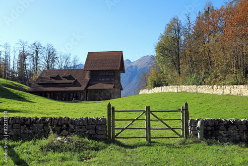 Old swiss tilery in autumn. View of the Alps. Municipality of Hofstetten bei Brienz, canton of Bern, Switzerland.