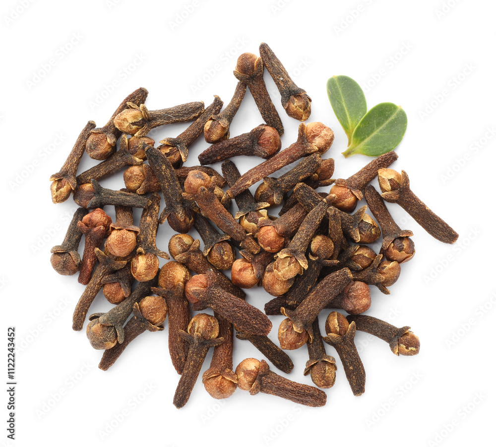 Fototapeta premium Dry clove buds and green leaves on white background, top view. Aromatic spice