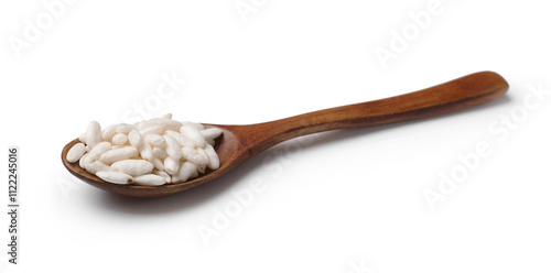 Puffed rice in spoon isolated on white photo