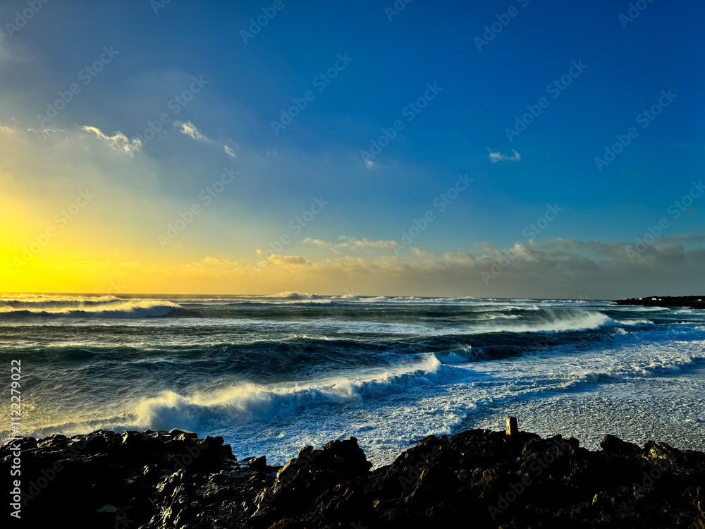 Obraz premium Sunset on a volcanic island
