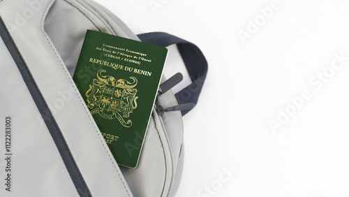 Benin Passport on a grey Travel Bag with white background copy space - Beninese photo