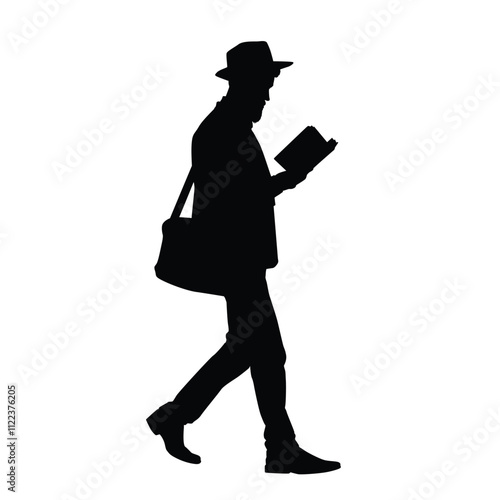 Silhouette of a man walking while reading a book