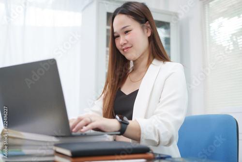Free Download A young, professional businesswoman working at her desk in an office, providing online legal consultancy for disputed civil cases, addressing lawsuits, loan defaults, unfair dismissals, and property - GFXLoad