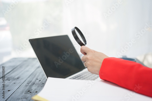 A cheerful businesswoman works at her office desk as a legal consultant, handling online civil cases, including debt disputes, unfair dismissals, foreclosures, land redemptions, with professionalism photo