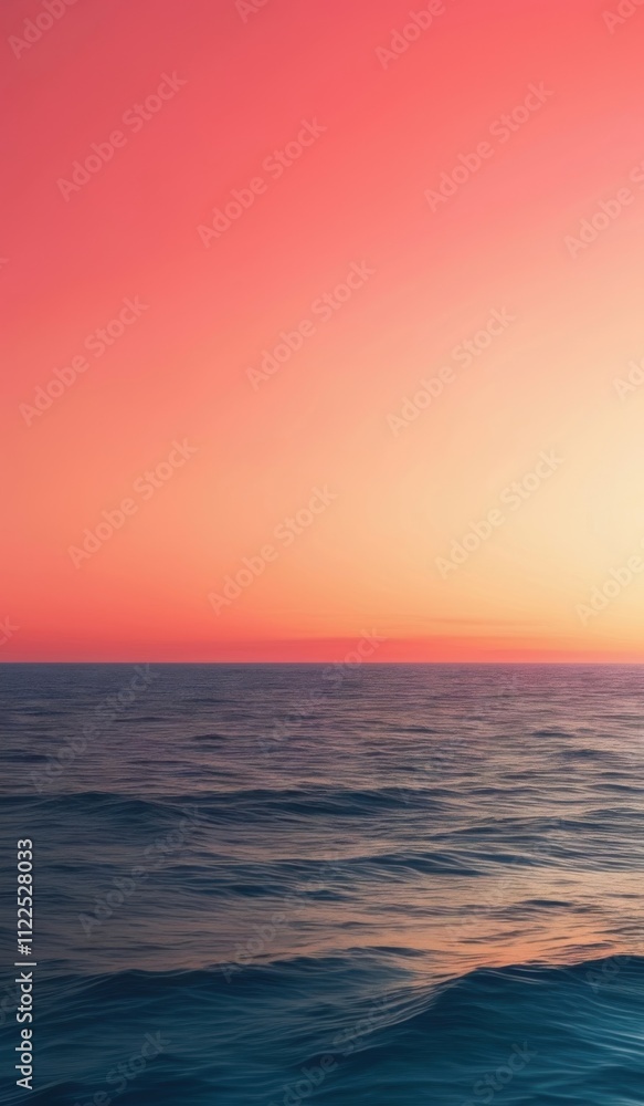 Fototapeta premium sunset over the ocean with a pink sky and a small wave