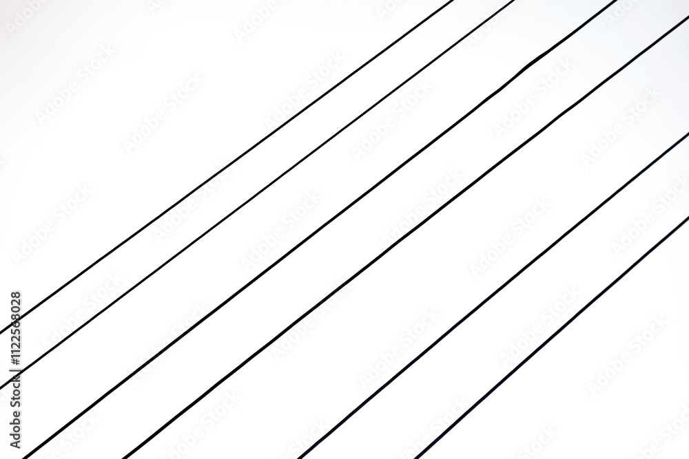 Fototapeta premium A minimalist abstract image featuring parallel lines against a white background. A simple yet striking composition.