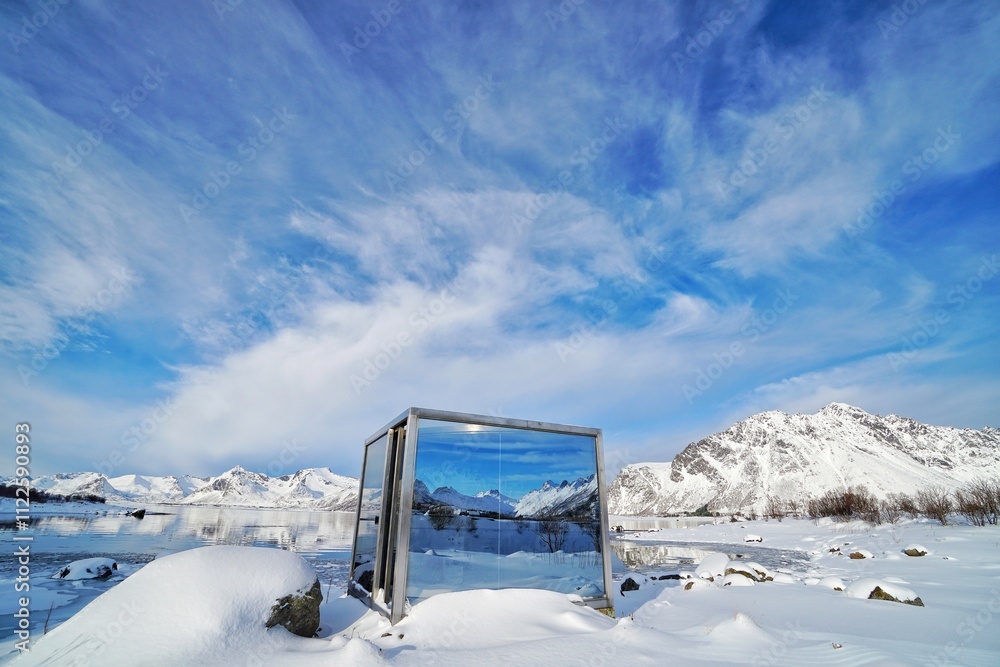 A mirror reflected snow mountain at Norway.