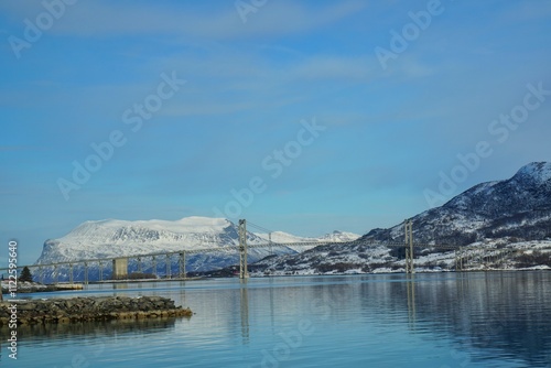 Beautiful bridge with snow mountain in winter season. photo