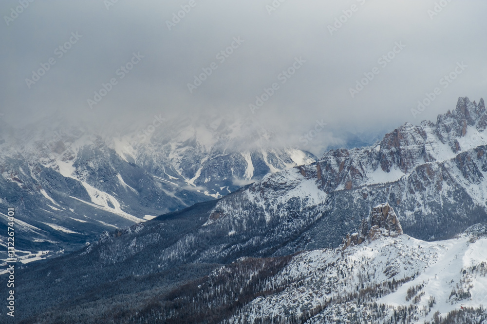 Stormy clouds in italian dolomites in a snowy winter