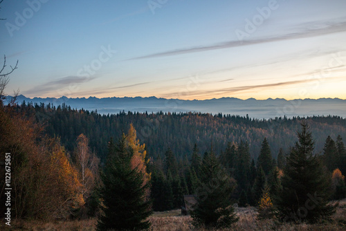 Panorama Tatr widziana z Góry Turbacz podczas zachodu słońca, jesienną porą. Gorce. Turbacz. Gorczański Park Narodowy. photo