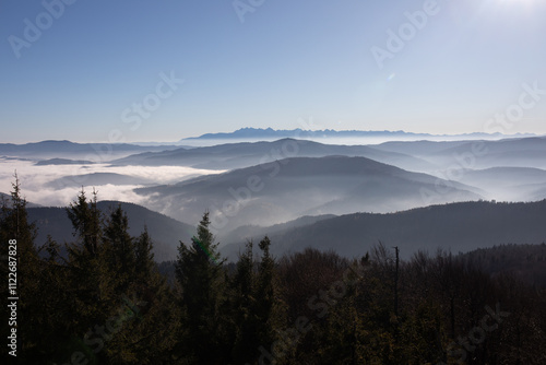 Widok na Tatry z wieży widokowej na Mogielicy. Najwyższy szczyt Beskidu Wyspowego. Beskid Wyspowy. Mogielica. Korona Gór Polski. photo