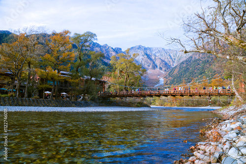 Fotografie Tourists on the kappa wooden bridge at Kamikochi National park, the northern part of the Japan Alps in Chubu region