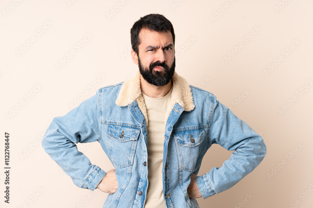 Fototapeta premium Caucasian man with beard over isolated background angry