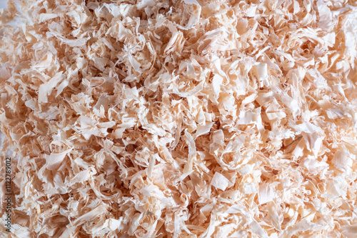 Close-up of wood shavings, with a detailed texture and natural lighting photo