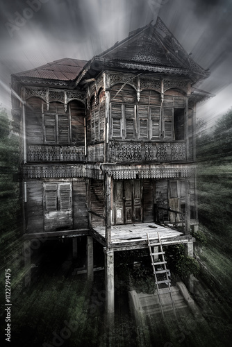 Old abandoned house surrounded by trees