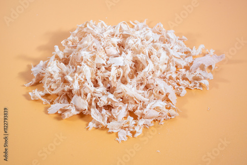 Close-up of wood shavings, with a detailed texture and natural lighting photo