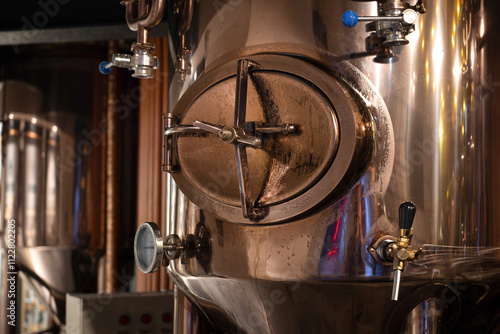 Detailed Close-Up of Copper Brewing Equipment in Craft Brewery photo