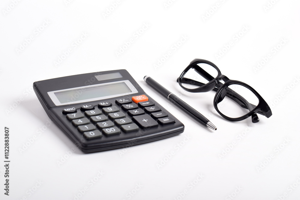 Calculator, glasses and pen isolated on white background, flat lay Calculator, glasses and pen isolated on white background, flat lay