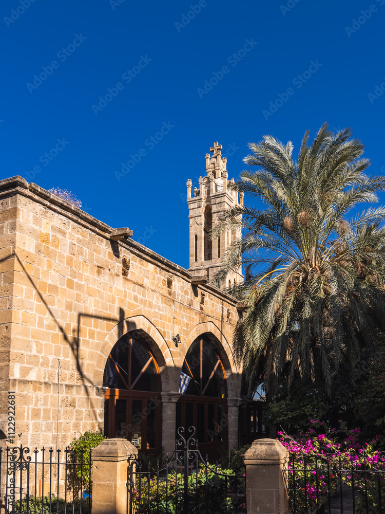 Historic Church in Nicosia with Tower and Palm Trees
