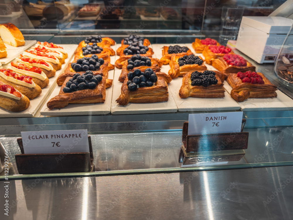 Pastry Display with Eclairs and Danish Pastries