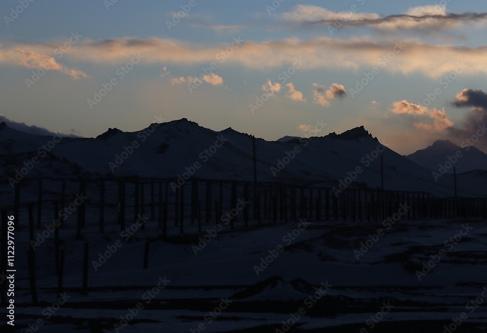 Fototapeta premium sunset over the mountains. Magical clouds in the mountains of Kyrgyzstan.