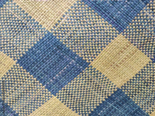 Hand weaving of blue and beige natural fibres 