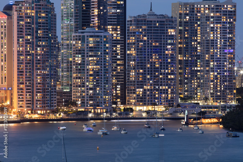 Large apartments buildings alongside the Brisbane River during the evening photo